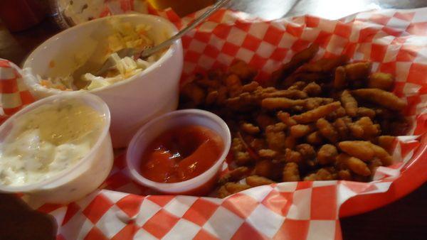 These little rolled-up burnt pieces of hard, fried breadcrumbs sold as "clam basket".  No trace of any clam material.