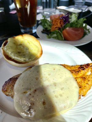 Blackened catfish on a brioche bun w/a side salad.  It comes w/lettuce & tomatoes on it but they left it off.  They brought it to me.  Yum!