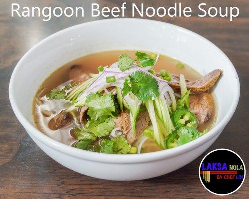 The soup base is made with beef. Served with rice noodles, vegetables, beef, and spicy ginger sauce.