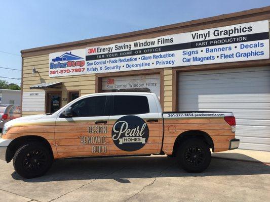 Truck wrap with wood grain vinyl. Perfect for this home builder.