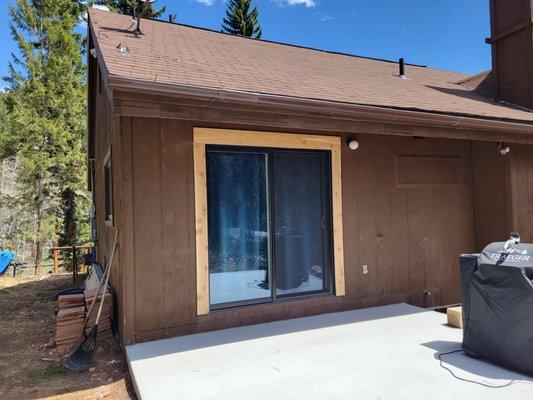 Black frame patio door installed by New Windows for America