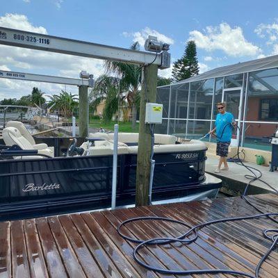 Washing a customers pontoon boat