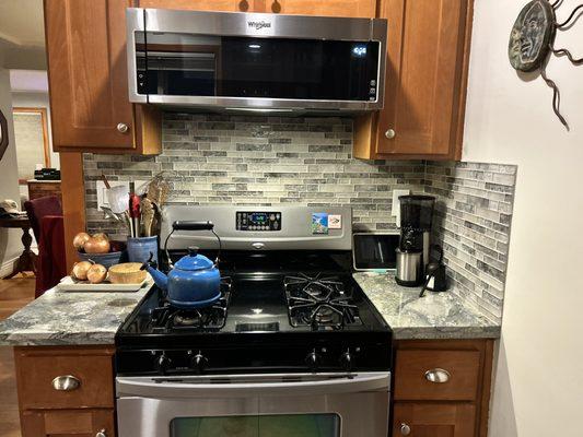 Beautiful backsplash and new microwave/hood vents to outside