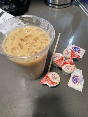 Fake Gas Station Iced Coffee with their complimentary cream and sugars.