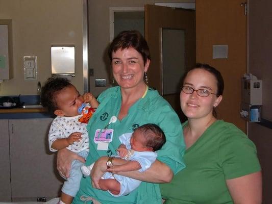 Nurse who helped doctor Dillon holding the babies