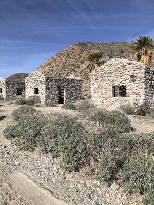 Stone huts with picnic tables