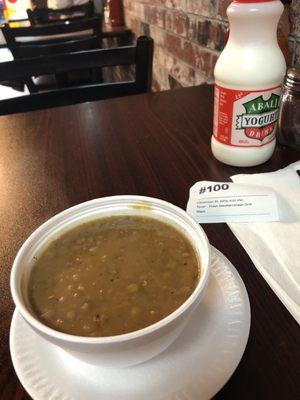 Lentil soup and yogurt drink.