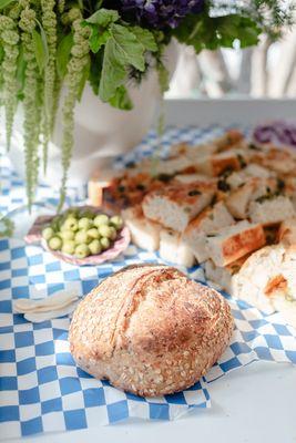 Seeded sourdough and sliced olive focaccia. This was for an event.