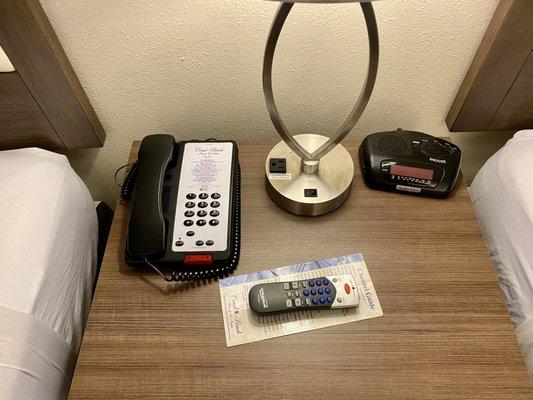 Telephone , alarm clock , TV remote and lamp has plug in for charging your phone , etc