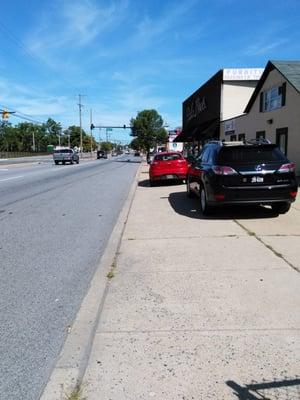 SIDEWALKS ARE FOR PEDESTRIANS. PARK IN PARKING LOT!