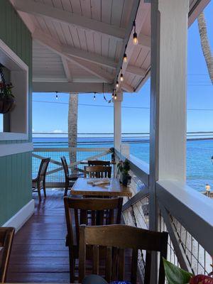 Ocean view from table, it's open air dining but with a roof.