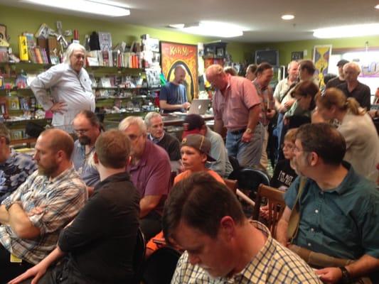 Just before a magician lecture. Larry, the towering owner, is standing in the white shirt on the left