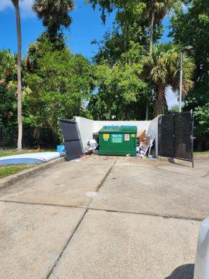 This is the dumpster area....old mattresses, trash on floor, disgusting.