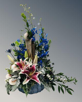 Ocean beach theme arrangement blue delph lilies with other flowers