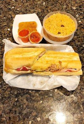 Cuban Sandwich, Ham Croquettes with homemade hit sauce (2 already eaten before picture) and 2 side of rice.