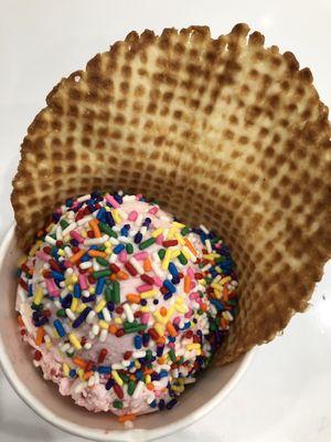 Strawberry on a waffle cup with sprinkles