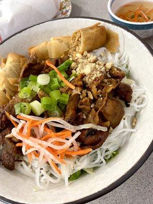 Vermicelli with egg rolls and pork