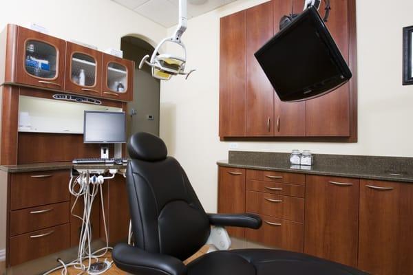 This is one of the seven patient treatment rooms.  Each room has chairs with lumbar and shoulder massages, as well as, a personal television