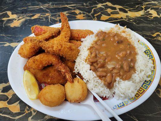 Seafood combo: Whiting, Crab Sticks, Jumbo Shrimp and Scallops w/ Rice and Beans.