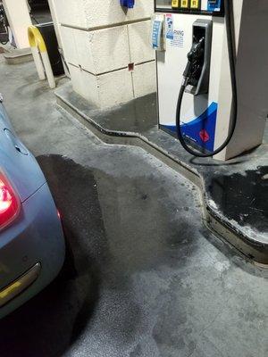 Picture of my gas soaked car, and the gas drenched ground and surrounding pump.