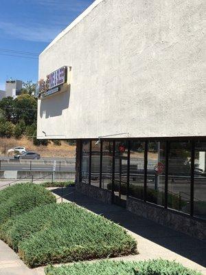 You can see the shop from the highway. They have a big parking lot in the back and plenty of street parking.