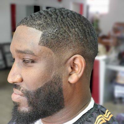 Dark and wavy low skin fade