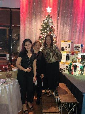 The owner, Monica, with our two caregivers at our 2018 Company Holiday Party.