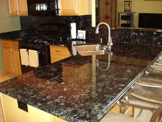 Volga Blue granite kitchen with Grohe RealSteel kitchen faucet