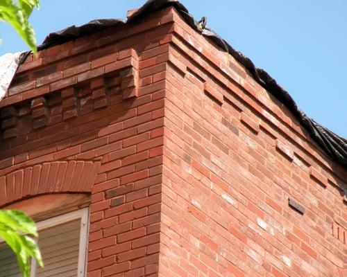 Our services provided demo and rebuilding of this brick masonry, matching and keeping with the historical integrity.