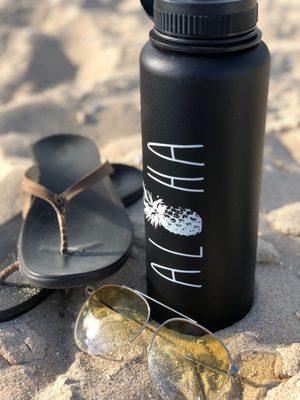 Olukai footwear and UV-printed flask.