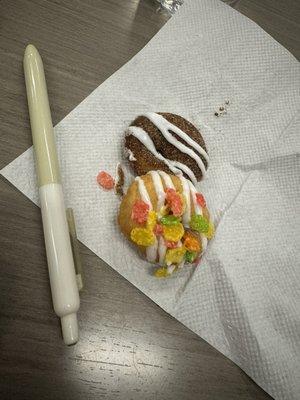 Mini donuts size compared to a pen. These are the Fruity pebbles and cinnamon roll donuts.