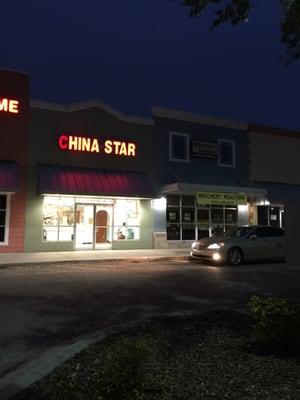 Store front with a line of cars parked in the fire lanes all the time