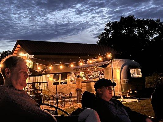 Relaxing around the fire pit. Full bar at the ready.