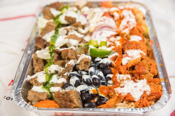 Chicken and lamb combo over rice with your choice of salad and sauces.