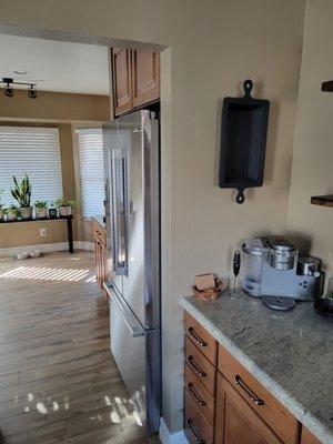 The wall next to the fridge was pushed back about 4" to accommodate a counter-depth fridge.