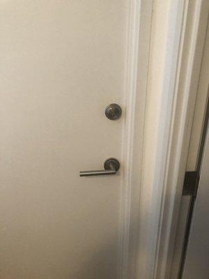 One fresh installation completed
Holes bored
Dead bolt satin nickel colored dead bolt installed on door above lever lock