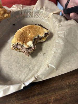 Half Eaten burger I forgot to take pictures when it came out.  He didn't even offer me a bite!