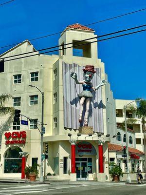 COOL PIECE ON FRONT OF CVS ! Built in 1988 as a piece for an art show. Represents a street performer mixed with a classical ballerina !