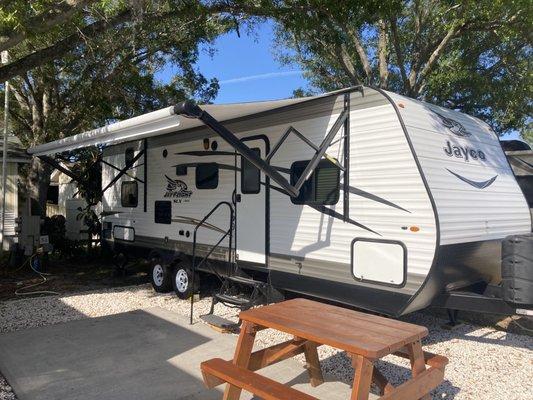 RV parked in good shade.