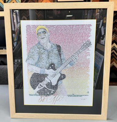 Custom framed Jimmy Buffett print using color core matting, UV glass & frame by Picture Woods, Ltd!