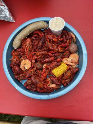 3lbs of crawfish, shrimp, boudin sausage, potatoes, corn, and sauce.