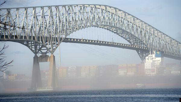 A boat traverses the Patapsco River en route to the Port of Baltimore under the I-695 Bridge.