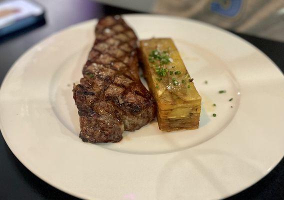 NY strip with potatoes pavé