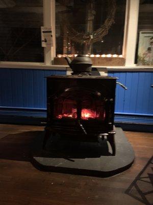 Wood burning stove, right next to our table