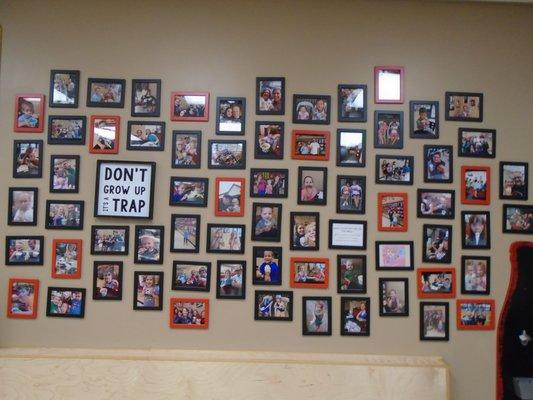 Brag wall with photos of happy customers.