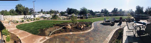 Concrete banding and fire pit. Please disregard The remaining yard since it is under construction.