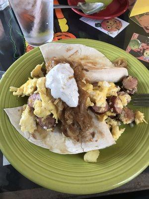 Potato quesadilla with eggs, sausage, onions (a LOT of onions) and chive cream.