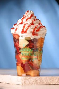 Enjoy our Paradise Fruit--a blend of fresh seasonal fruits covered with your choice of our Island Toppings and whipped cream.