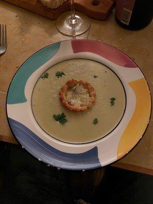 Jerusalem artichoke soup with pastry and cheese in the middle.