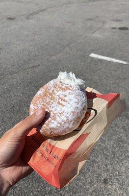 Powdered white cream filled donut